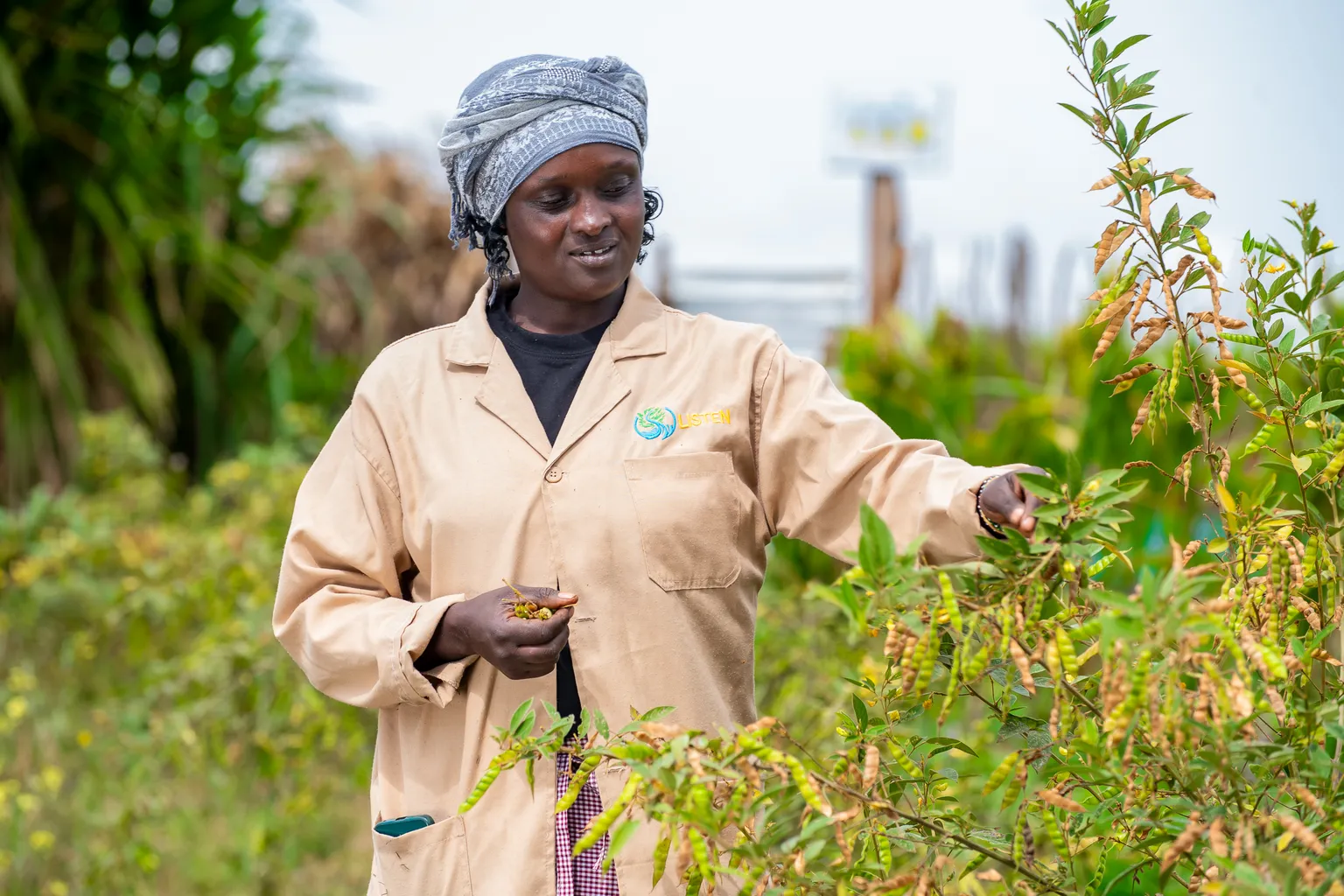Woman with crops on her farm