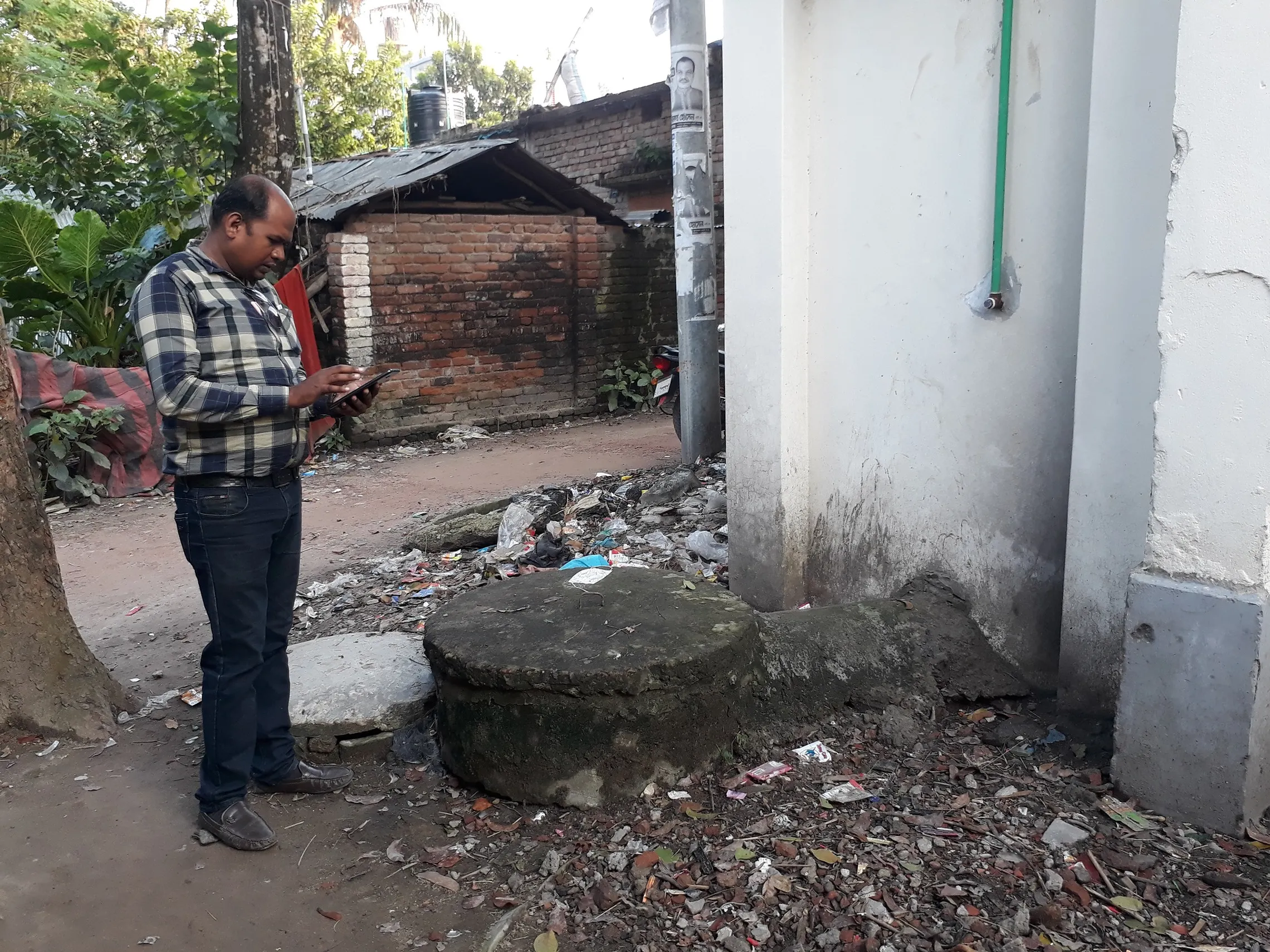 FSM manager of AID Foundation is assessing the fee, number of trips, etc. while providing sludge emptying service to an applicant in Jhenaidah