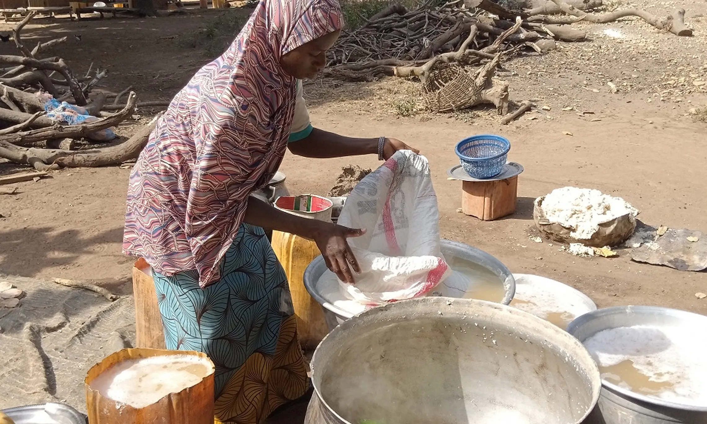 Soy cheese processing in Sinasso, Municipality of Parakou where a solar-powered water station was set up by AProDESE-ONG 