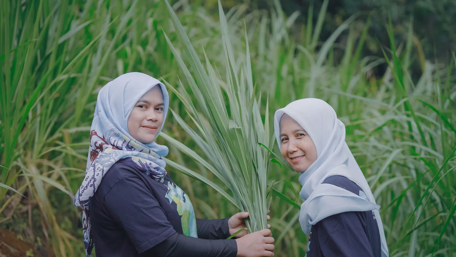 Two female farmers in the PAHALA project implementation area