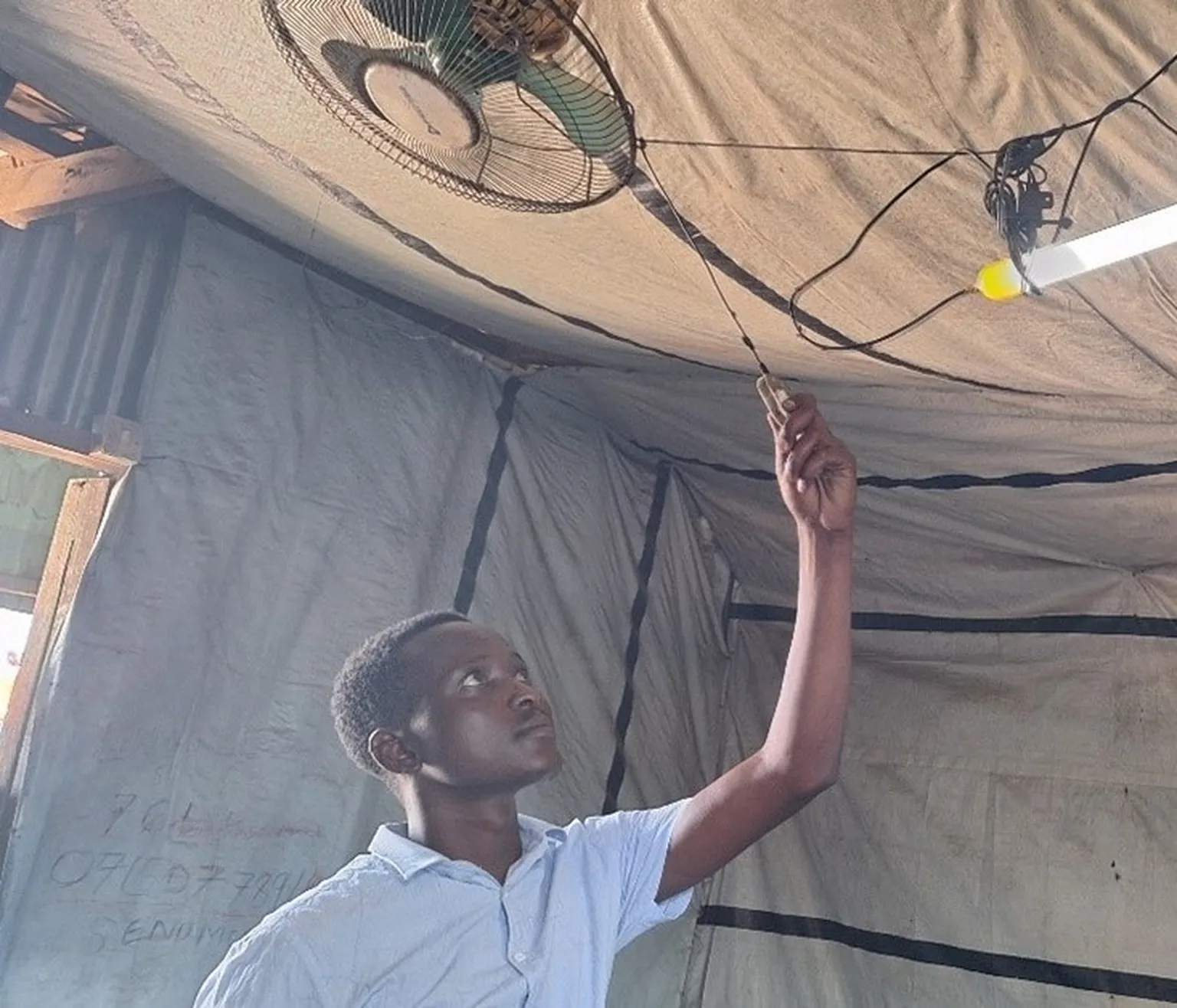 Man with solar powered fan