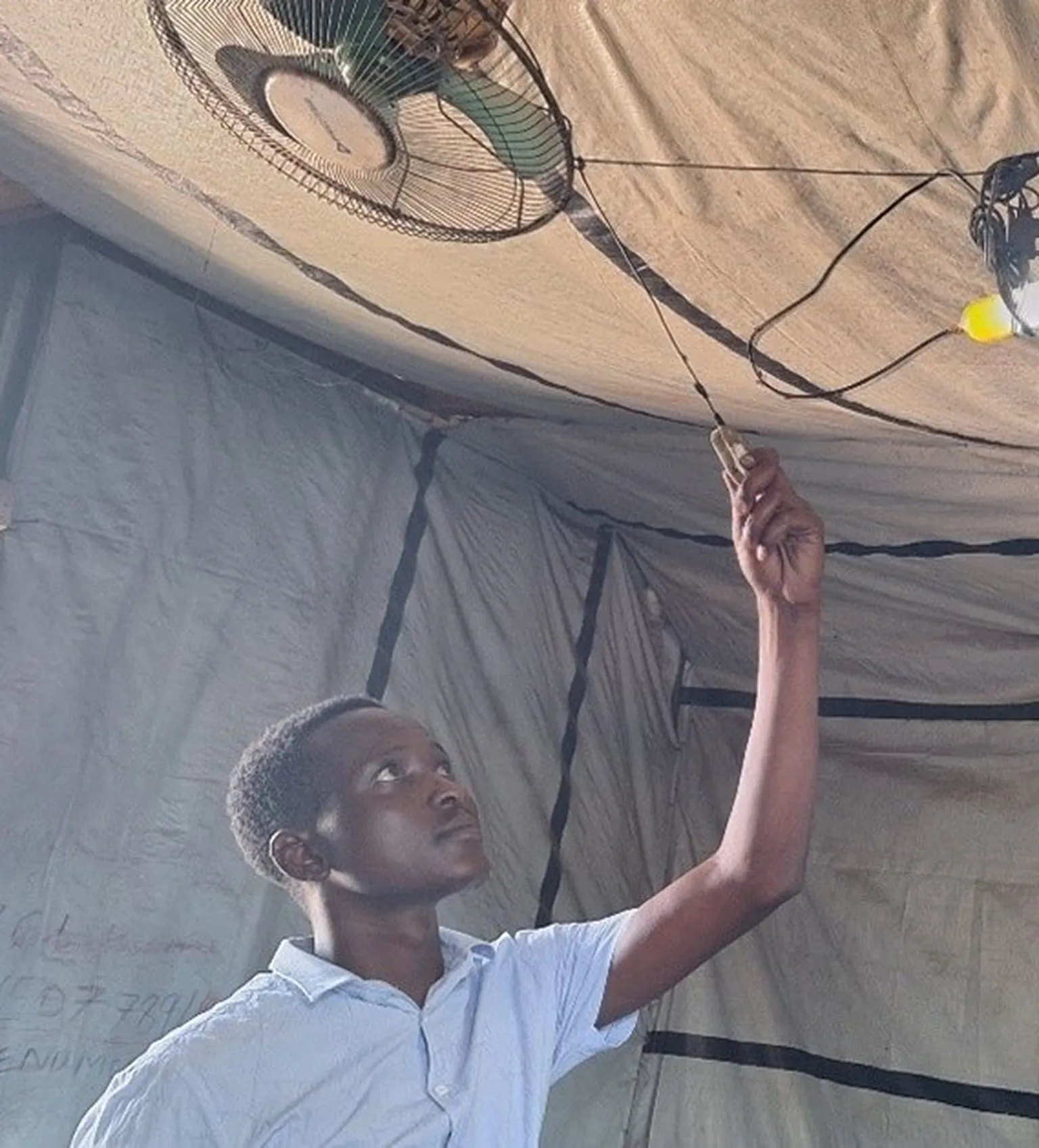 Man with solar powered fan