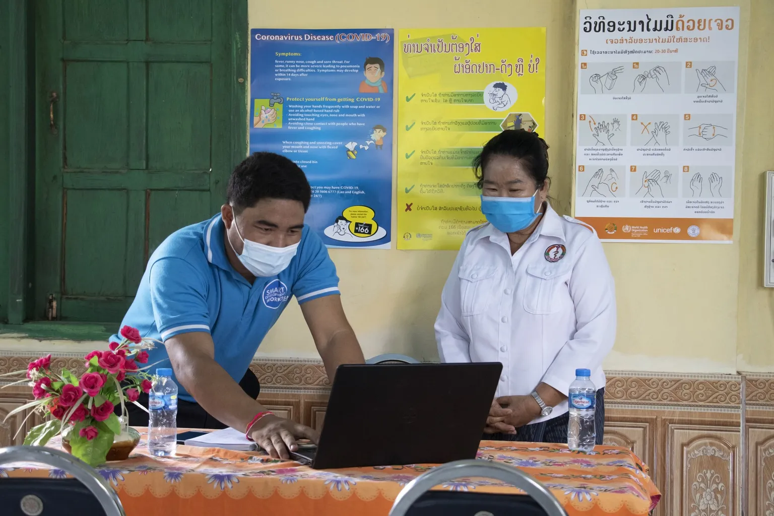 Ms Chomsy Ngamvilay [on right], Deputy Head of the Atsaphone District Health Office, Savannakhet Province in Lao PDR