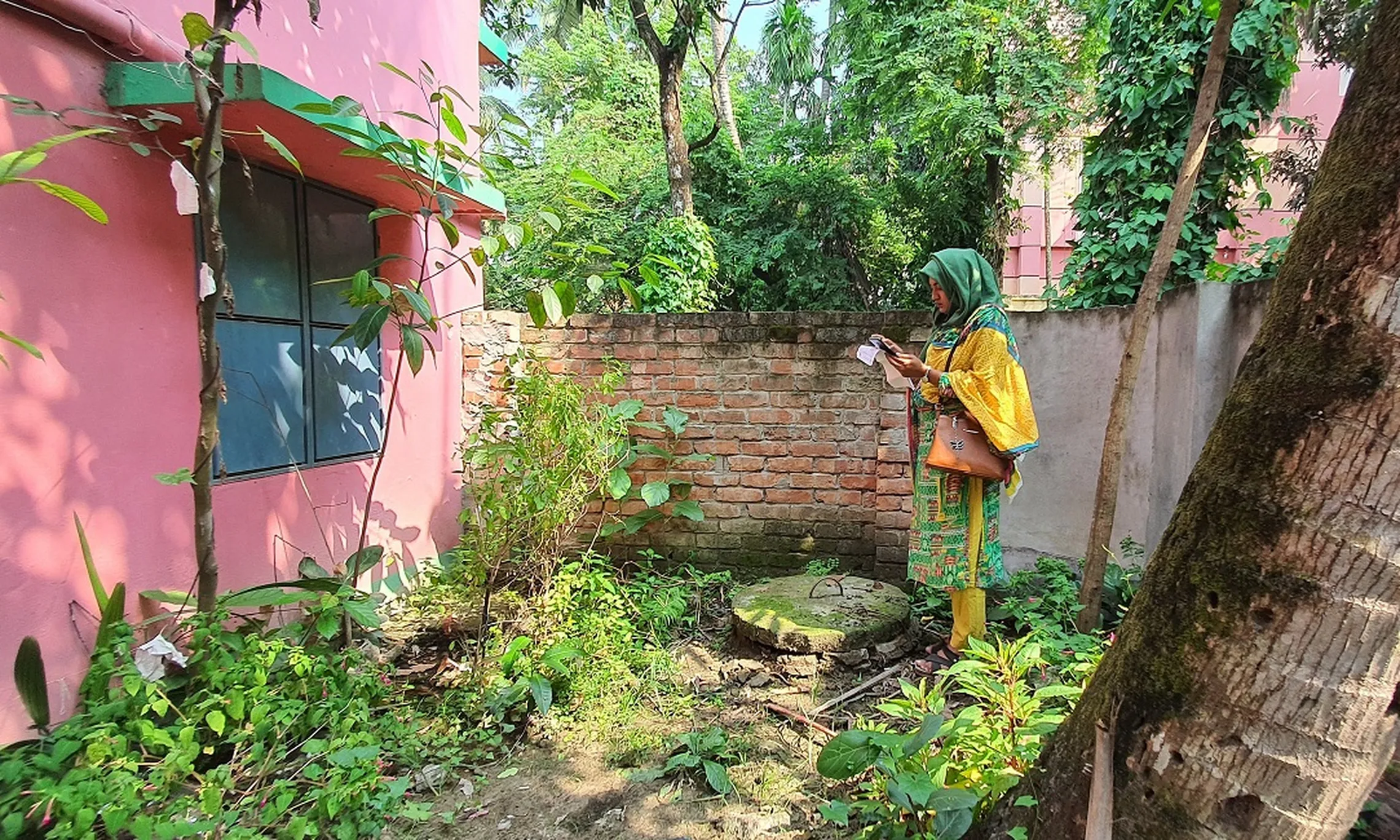 FSM IT Assistant at Jashore's FSM unit collecting containment data using IMIS mobile app