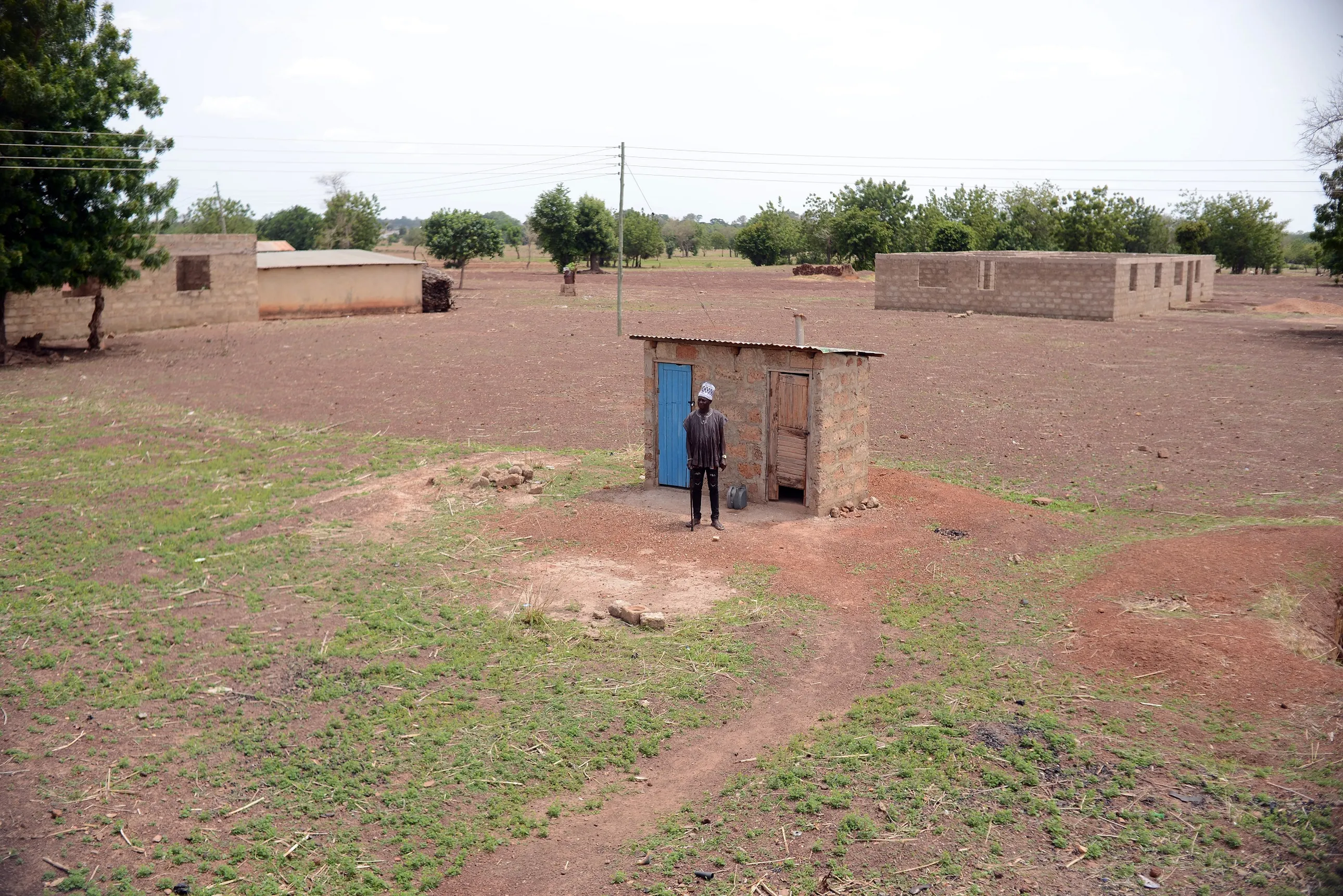 Chief of Kamba in Nandom standing in front of his newly built toilets (SNV Ghana)