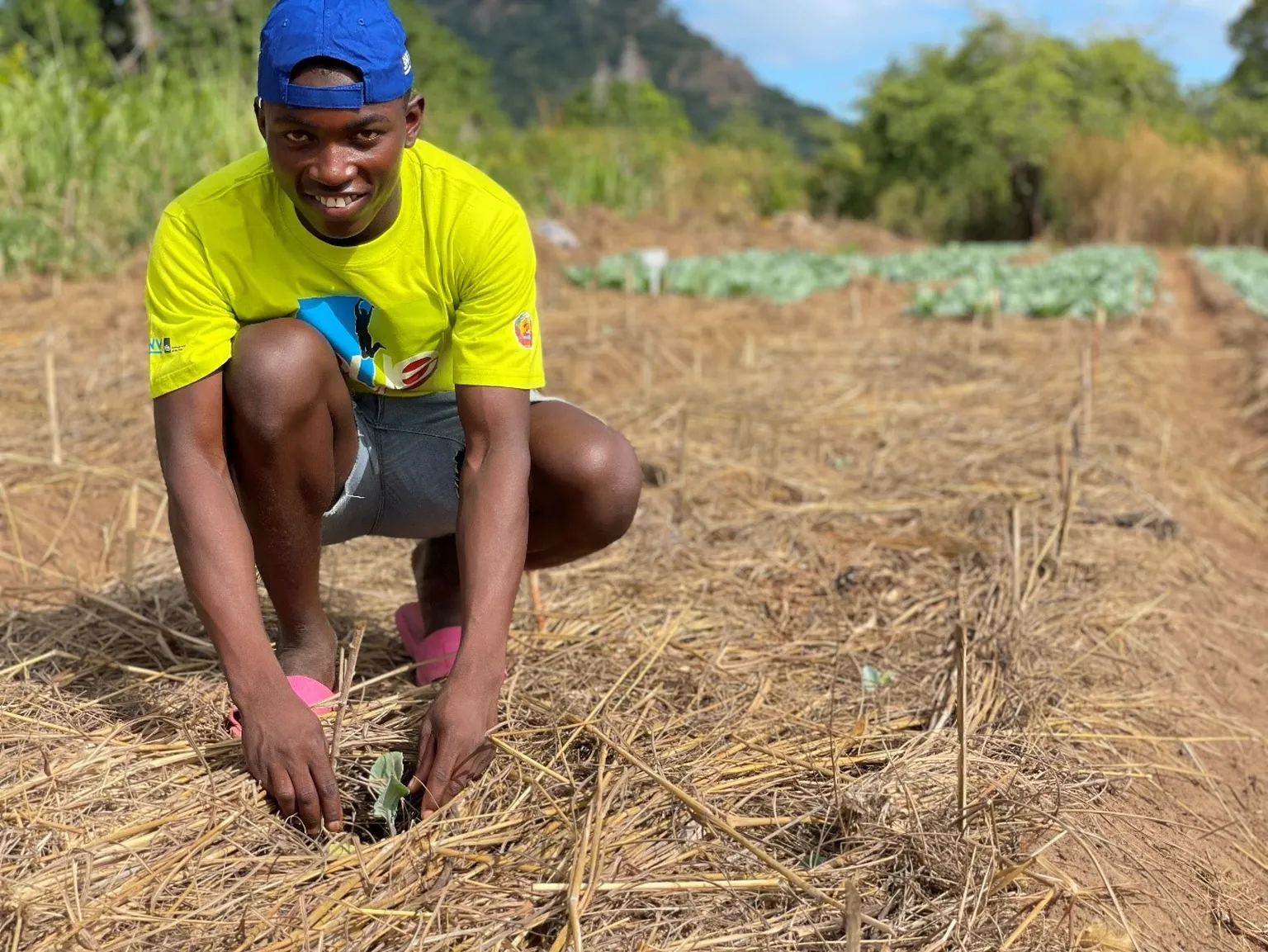 A photo of Augusto Agostinho in an agricultural field