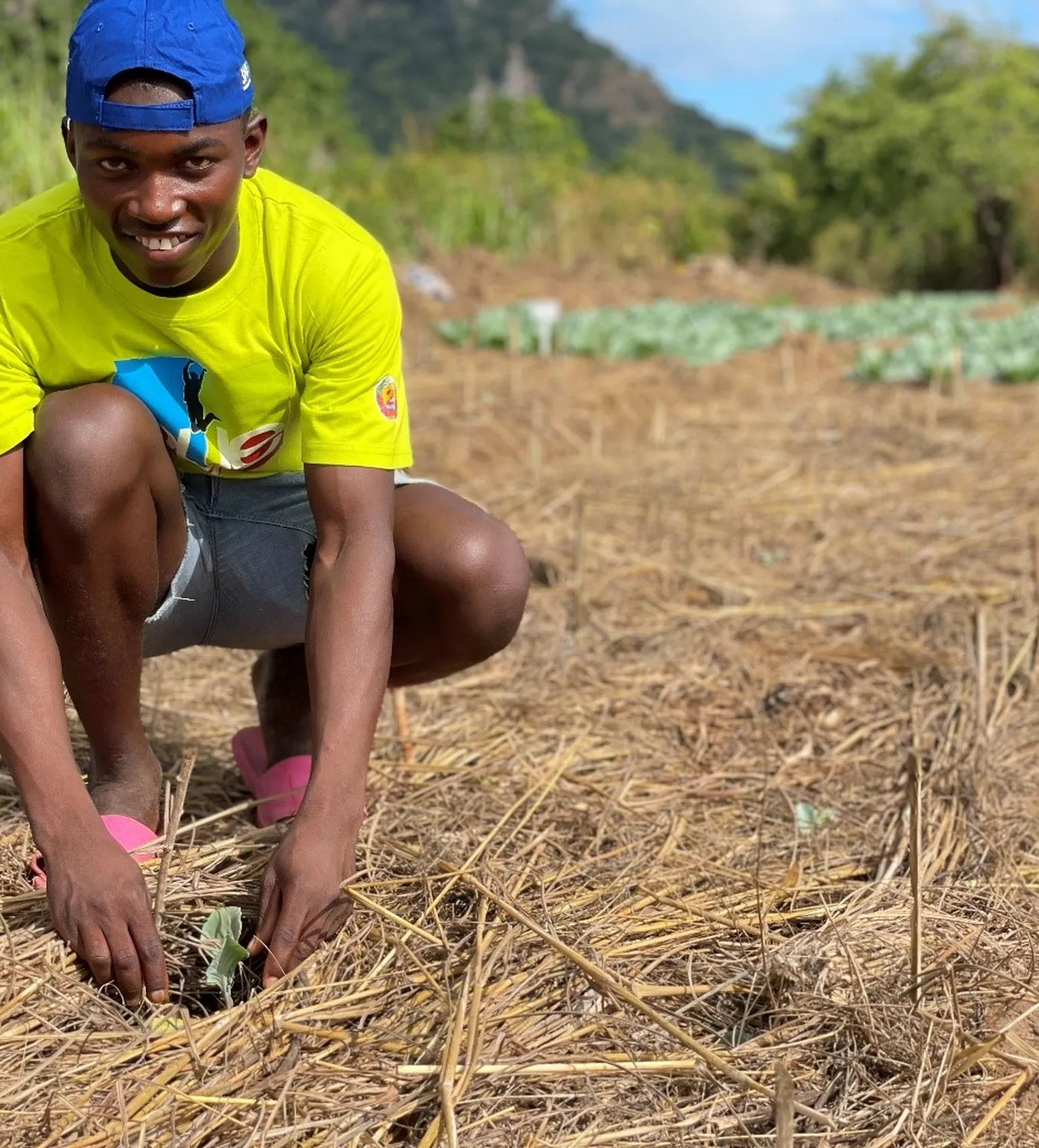 A photo of Augusto Agostinho in an agricultural field